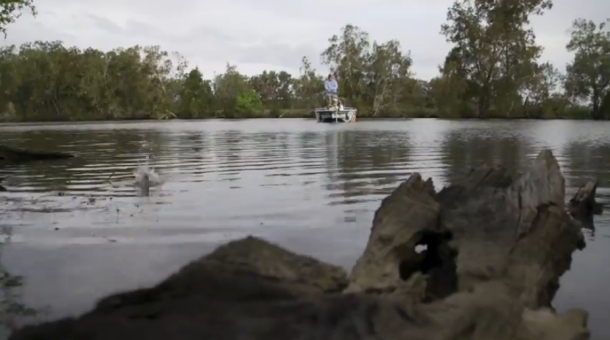 Chris Cleaver with his recently caught and released hybrid cod he likes to call a Murrout (cross between a Murray and trout cod).